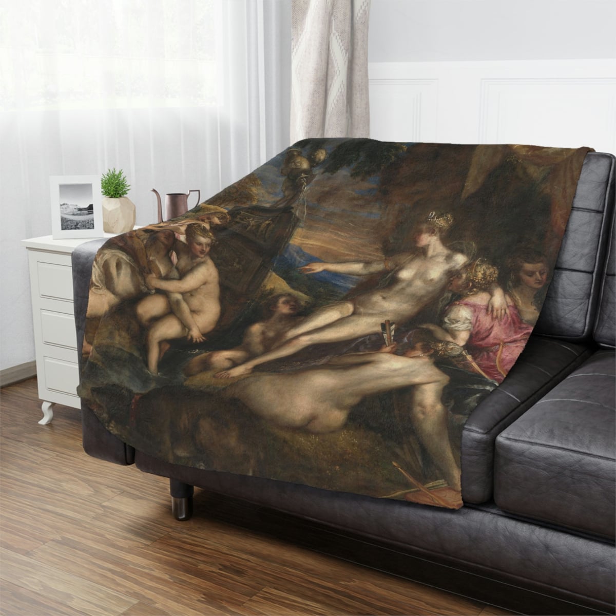 High-resolution Titian's Diana and Callisto Art Blanket draped over a couch
