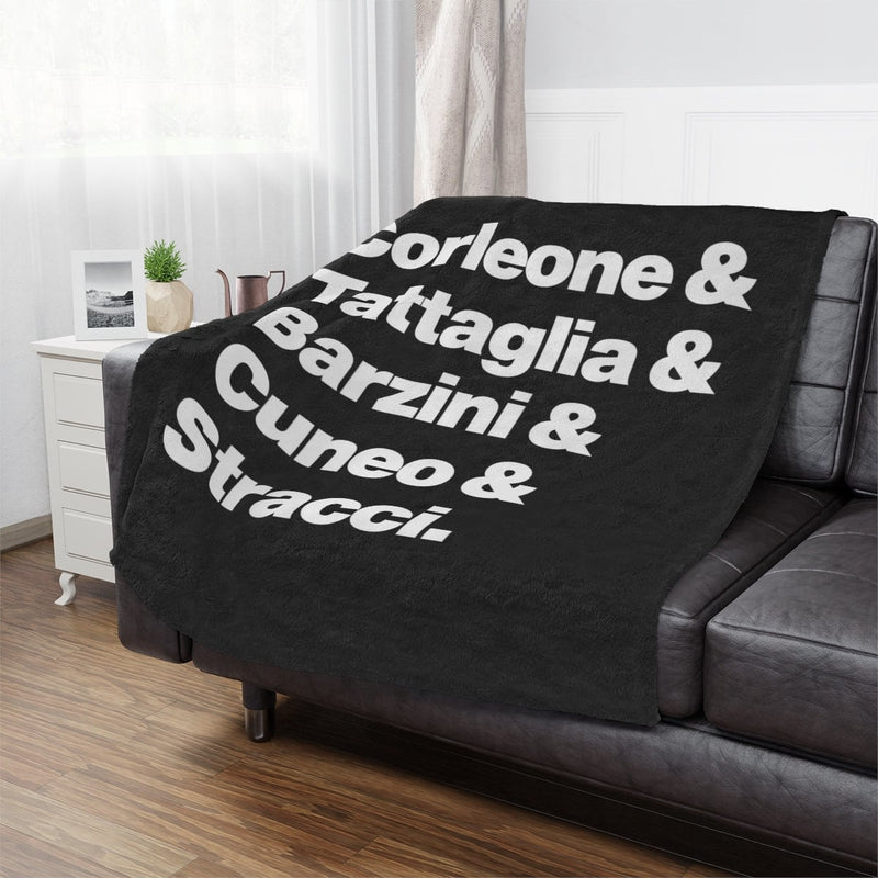 New York Crime Families Minky Blanket draped over a sofa, adding mobster heritage to home decor.